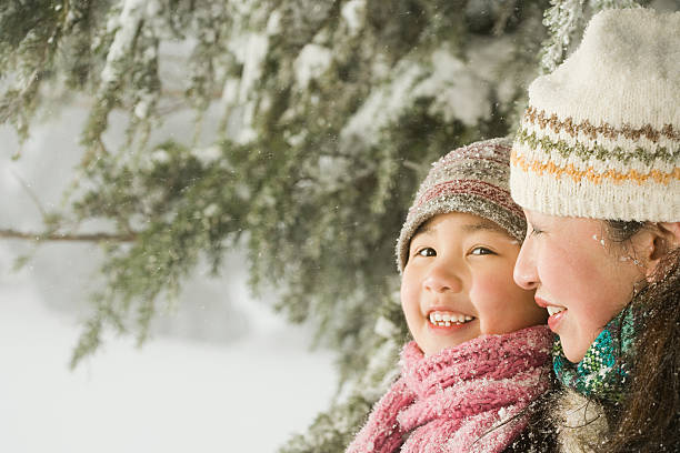 istock Mother and daughter in hats 533956623