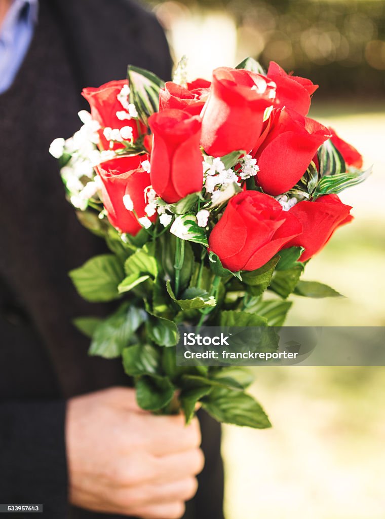 man giving bunch of rose for st. valentine man hiding bunch of rose  2015 Stock Photo