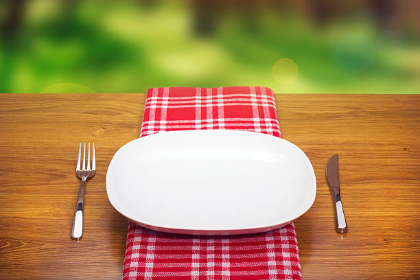 istock Empty plate in the forest on a wooden table 533958821