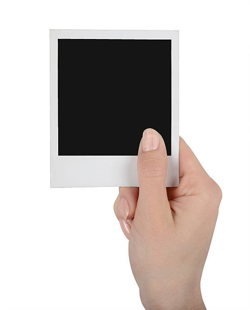 istock Instant photo in female hand 533960199