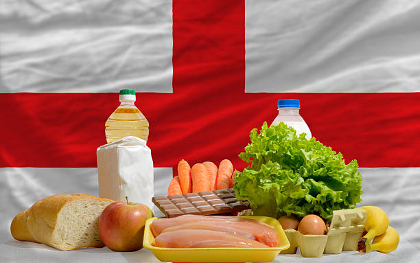 istock basic food groceries in front of england national flag 533960267