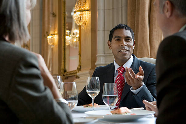 istock Colleagues In Discussion At Restaurant Table 533961339