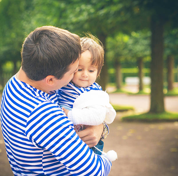 istock father with child on nature 533962133