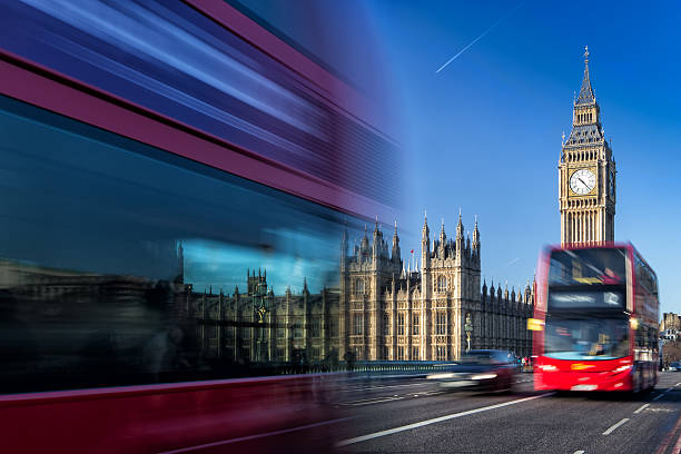 istock Big Ben and passing red buses, London, United Kingdom 533966027