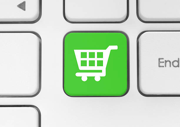 istock Shopping cart icon on green button 533966111