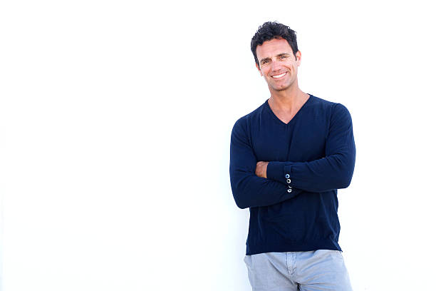istock Handsome rugged man smiling against white background 533974566