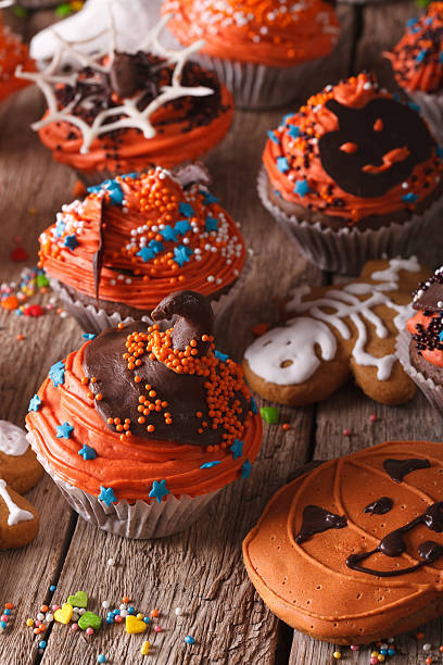 istock Halloween cupcakes and gingerbread cookies close-up. vertical 533974866