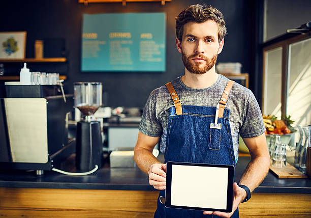 istock Barista holding digital tablet with blank screen 533976108