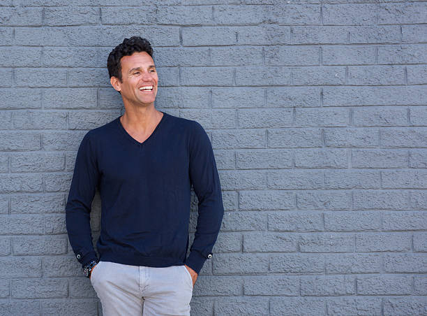 istock Fit older man smiling against gray wall 533976370