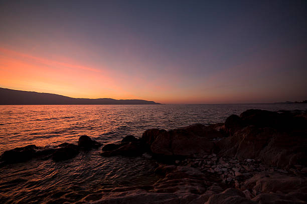 istock sun set on garda lake 533977442