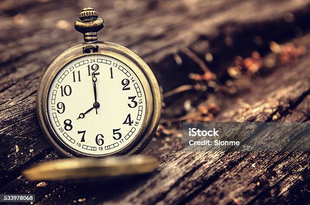 Vintage Pocket Watch On Grunge Wood Log Stock Photo - Download Image Now - Clock, Pocket Watch, 12 O'Clock