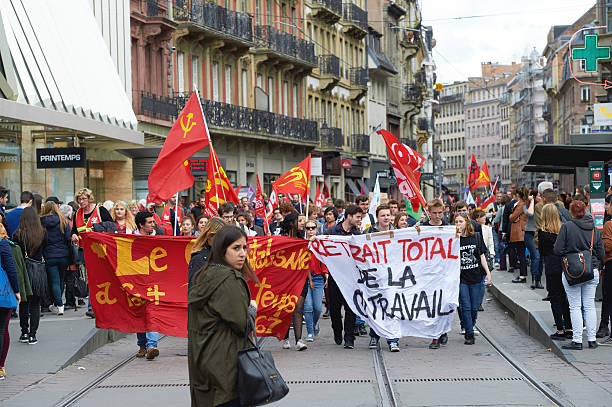 Protesters blocking city center Strasbourg, France - May 19, 2016:  Protesters blocking tramway lines in the center of Strasbourg during a demonstrations against proposed French government's labor and employment law reform riot police stock pictures, royalty-free photos & images