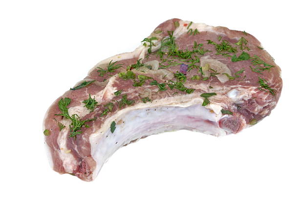 istock White Isolated Raw Marinated Pork Rib Steak For BBQ Grilling 533982522