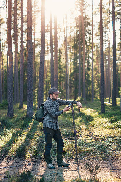 istock Hiker Looking for Connection On His Smartphone While In Nature 533983960