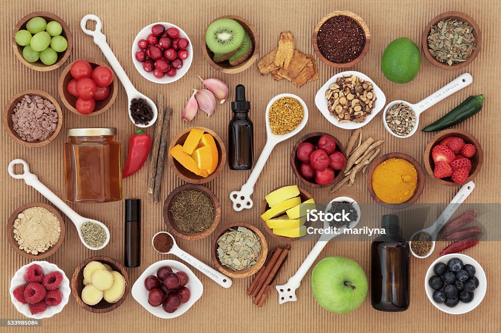 Food and Medicine for Cold Remedy Large food and alternative medicine selection for cold remedy to boost immune system, high in vitamins, antioxidants and minerals Camu Camu Berry Stock Photo