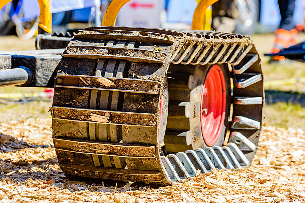 Emmaboda forest and tractor fair Emmaboda, Sweden - May 13, 2016: Forest and tractor (Skog och traktor) fair. Close up of crawler tracks on forest machine. humphrey bogart stock pictures, royalty-free photos & images