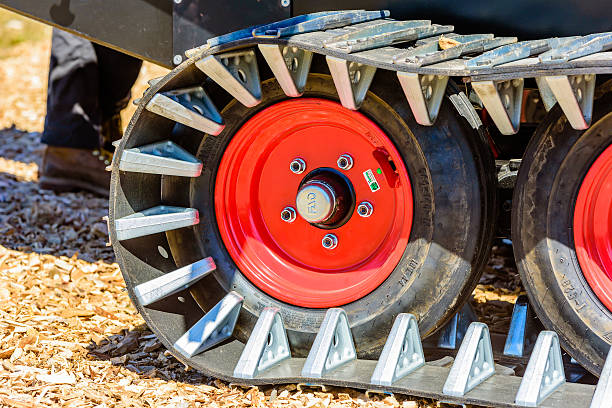 Emmaboda forest and tractor fair Emmaboda, Sweden - May 13, 2016: Forest and tractor (Skog och traktor) fair. Close up of crawler tracks on forest machine. humphrey bogart stock pictures, royalty-free photos & images