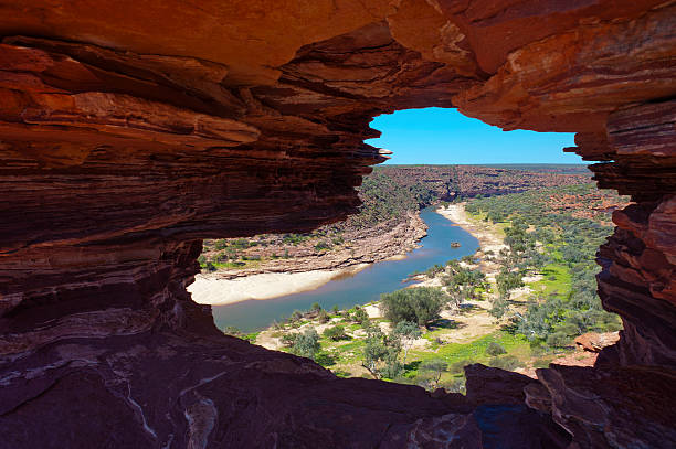 The view to the winding river through the natural geological rock formation 'Natures Window' in Kalbarri National Park, Western Australia.
