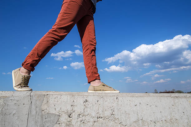istock People widely walks on the concrete wall at the level 533989040