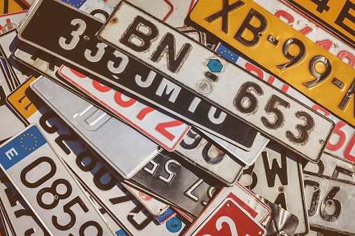 Rosmalen, The Netherlands - May 8, 2016: Vintage European car license plates on a flee market in Rosmalen, The Netherlands