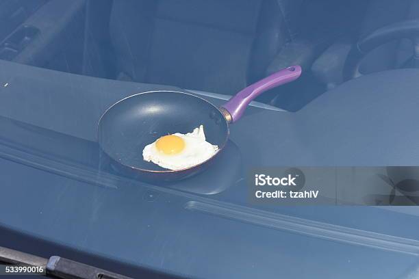 Fried Egg Cooking In A Closed Car Stock Photo - Download Image Now - Car, Heat - Temperature, Egg - Food