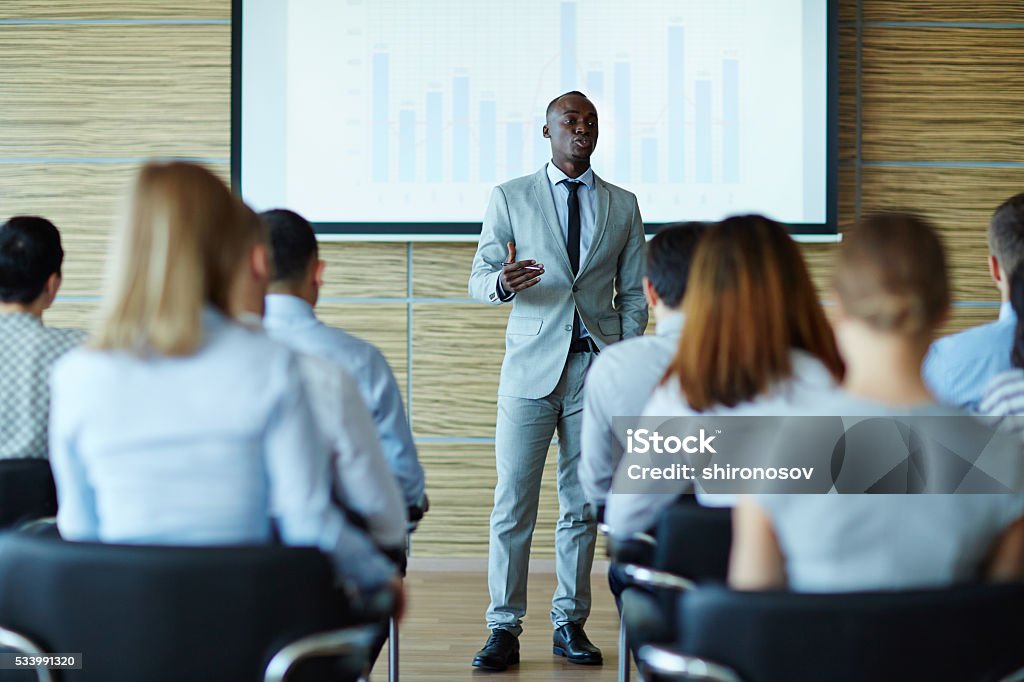 Explaining project Young teacher presenting new project to managers Presentation - Speech Stock Photo