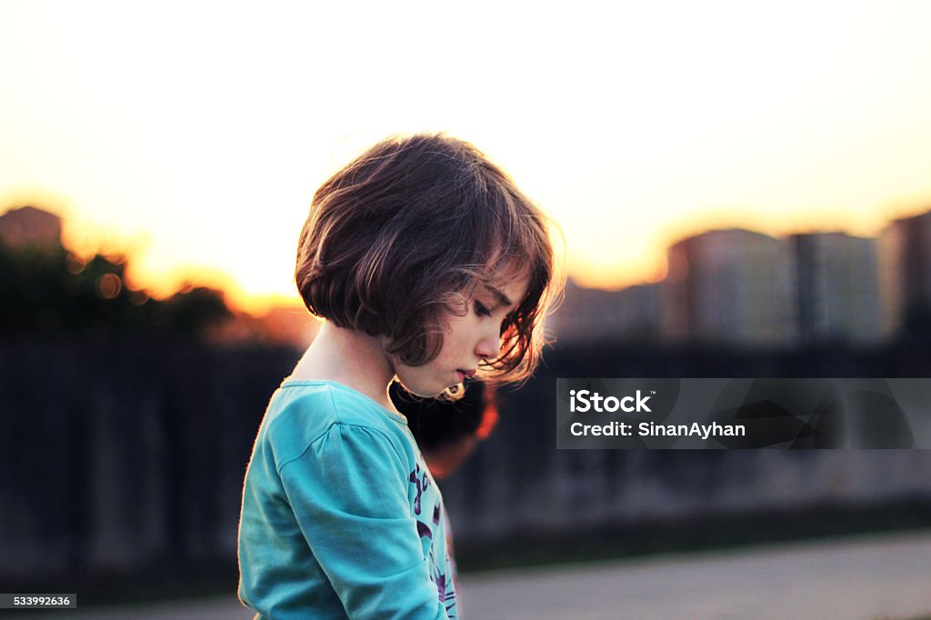 Waiting for happinies wait for a new day at sunset.  Child Stock Photo