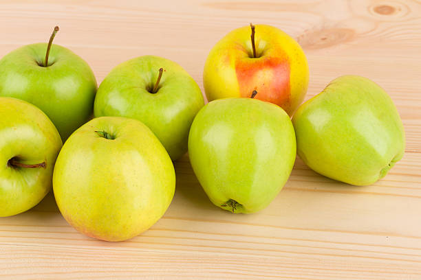istock Fresh green apples on wood. 533992890