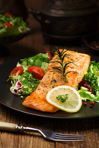 istock Baked salmon served with fresh vegetables. 533993066