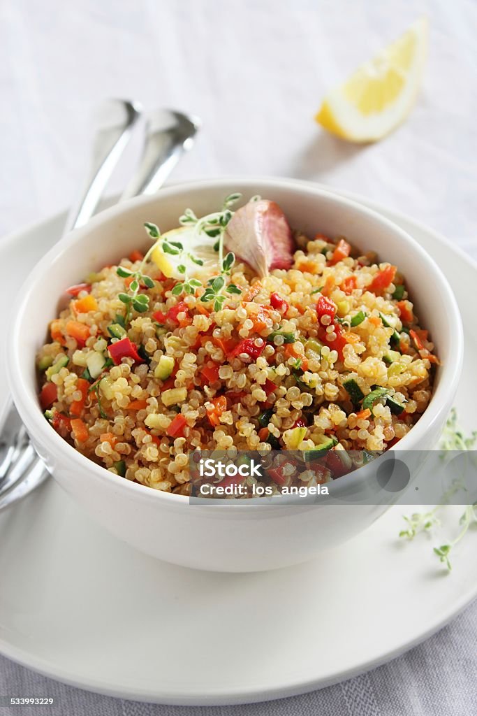 Quinoa salad with vegetables,herbs and lemon. Tabbouleh Stock Photo