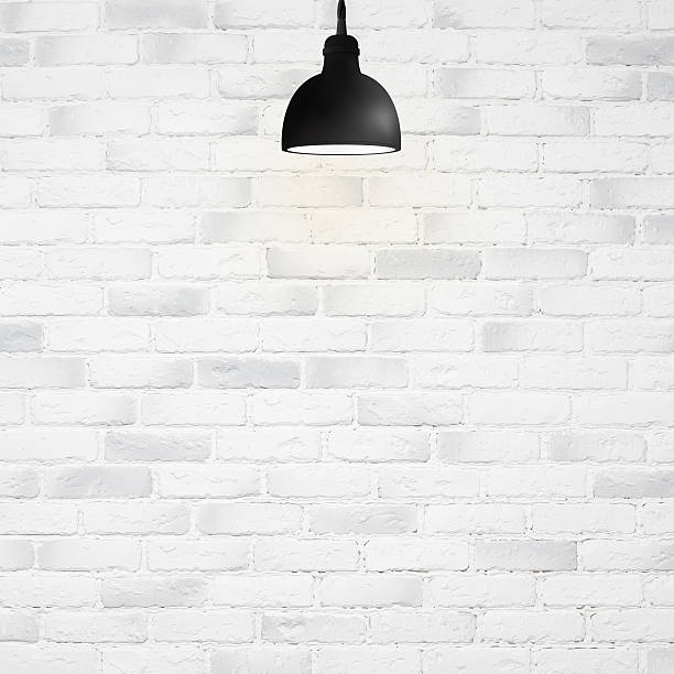 istock white brick wall background with retro lamp 533993243