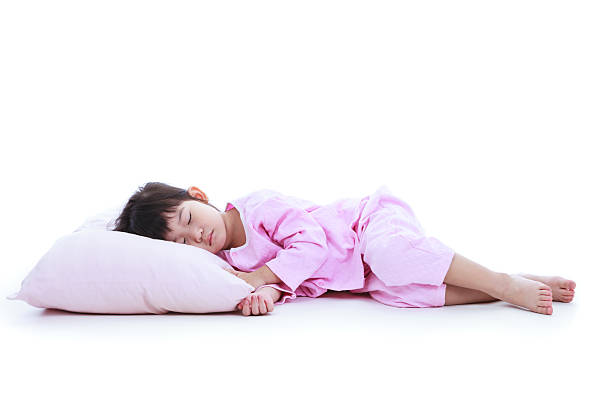 Full body. Healthy children concept. Asian girl sleeping peacefu stock photo