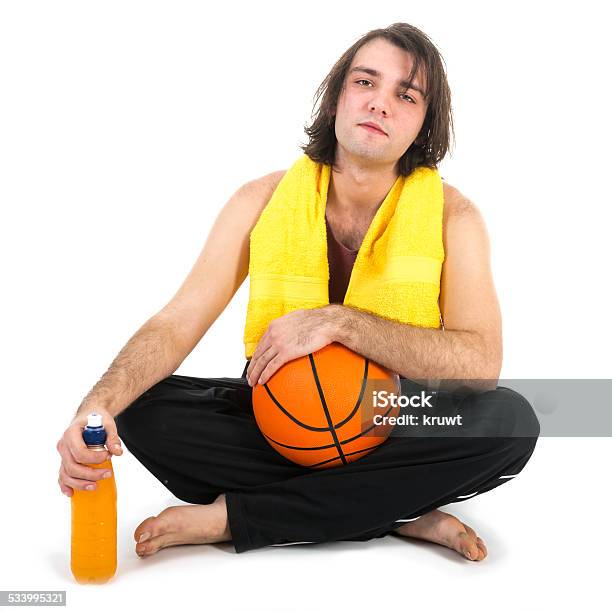 Man Sitting On Floor With Basketball And Orange Juice Stock Photo - Download Image Now