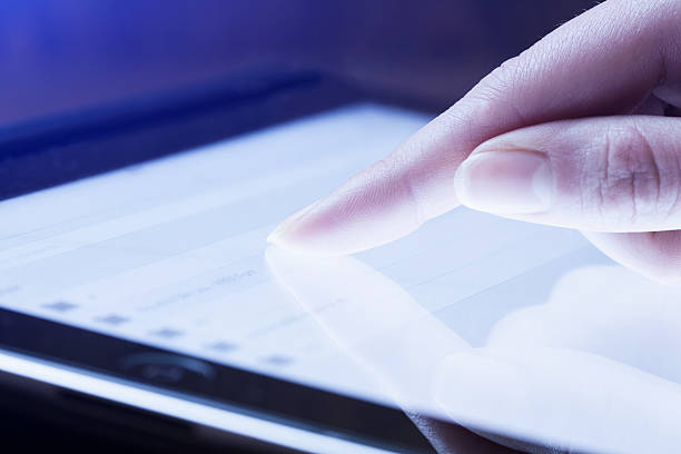 istock woman hand presses on screen digital tablet 533995433