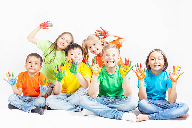 istock Happy kids with painted hands smiling 533995906
