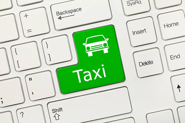 Close-up view on white conceptual keyboard - Taxi (green key)