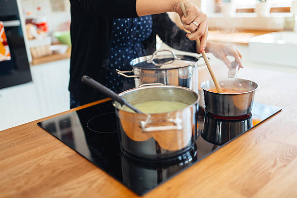 istock Woman making lunch in kitchen 533998410