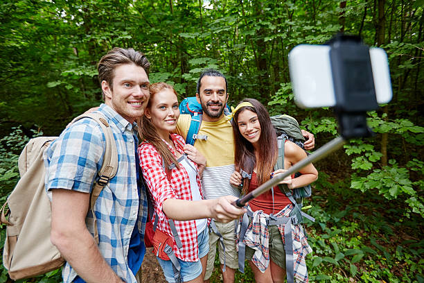 istock friends with backpack taking selfie by smartphone 533998614