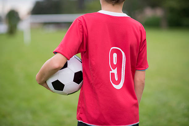 istock An elementary age boy is standing on the side of the 533998868