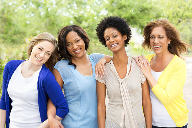 Multi ethnic group of friends laughing.