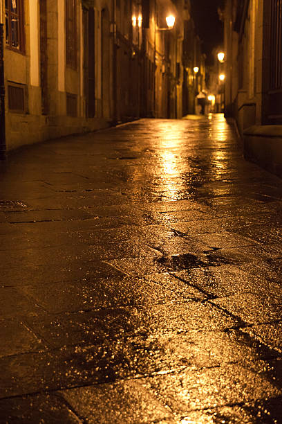 istock Old wet street at night 534000625