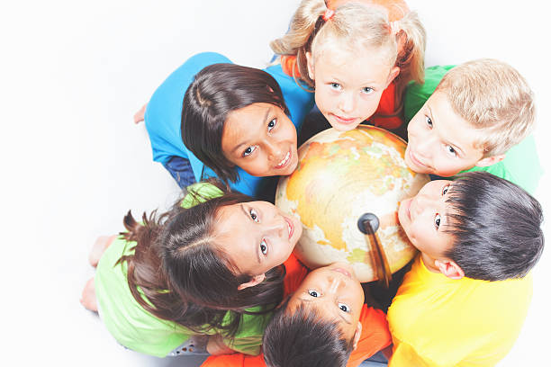 istock Group of international kids holding globe earth 534000960
