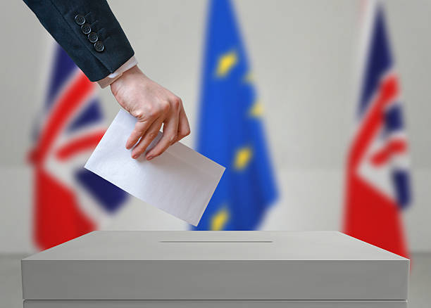 istock Election or referendum in Great Britain. Voter holds envelope. 534001226