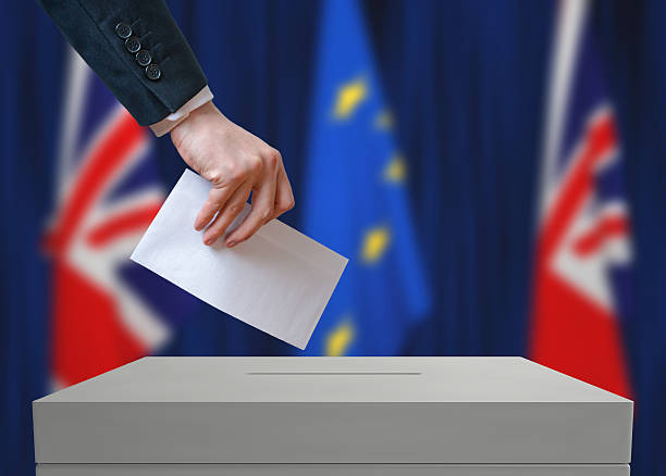 istock Election or referendum in Great Britain. Voter holds envelope. 534001330