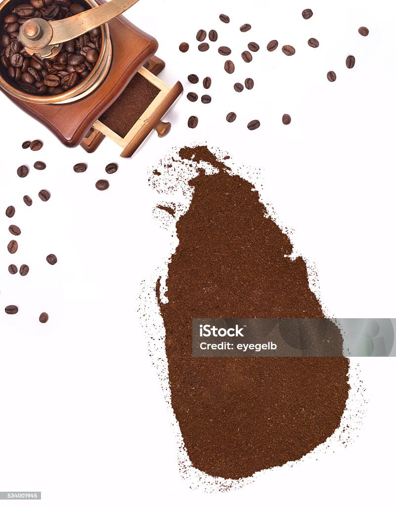 Coffee powder in the shape of Sri Lanka.(series) Coffee powder in the shape of Sri Lanka and a coffee mill.(series). 2015 Stock Photo