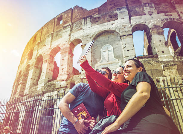 istock Tourists taking a selfie in front of the Coliseum, Rome 534002343