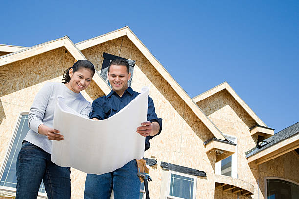 istock Couple looking at a blueprint 534002503