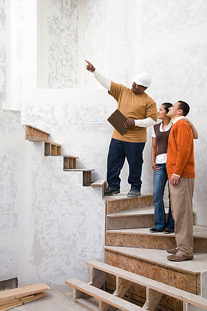 Builder with a man and woman