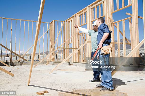 Builders On Construction Site Stock Photo - Download Image Now - Construction Industry, Residential Building, Home Interior