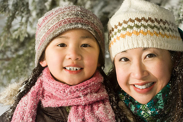 istock Mother and daughter in hats 534003191